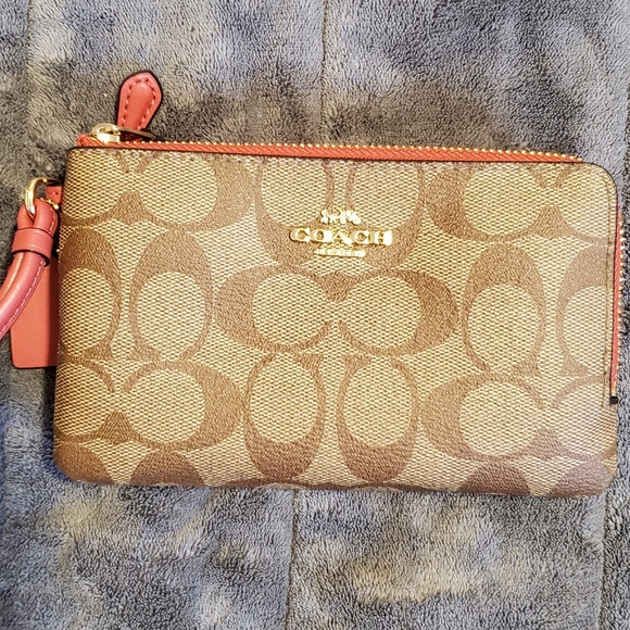 Coach Handbags - New COACH wristlet/wallet with pink trim